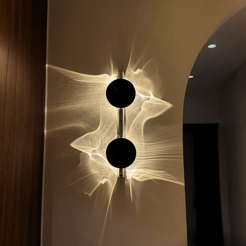 Golden ripple wall light glowing warm on a bedroom wall for a cozy winter room