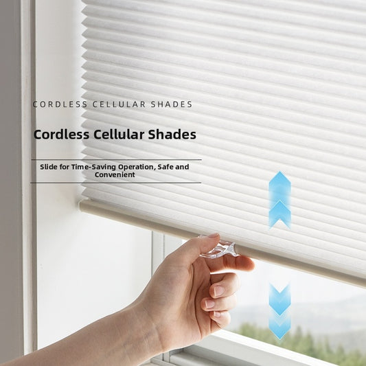 Cordless cellular shades with a hand operating them, slide for time-saving operation.
