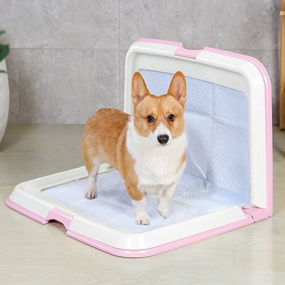 Dog standing inside a pink and white pet gate on a light wooden floor.