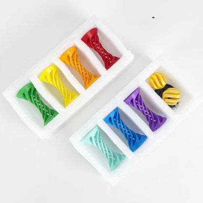 Set of colorful hair clips on a white tray