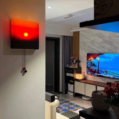 Modern living room with a wall clock displaying a sunset and a television showing a beach scene.