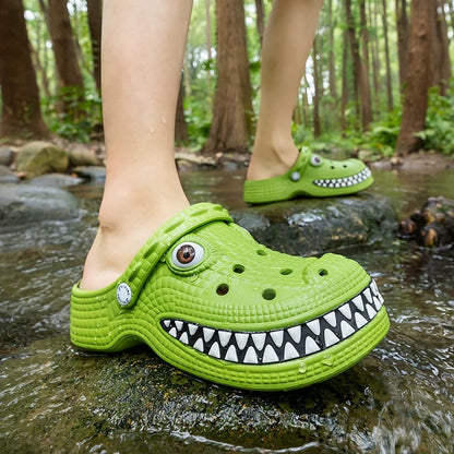 Green crocodile-themed clogs worn in a forest setting