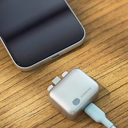 Phone with a charging adapter on a wooden surface