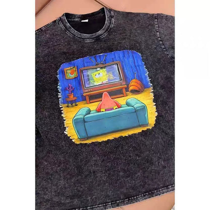 Black funny graphic tee with a colourful couch and TV print that hides a phone pocket