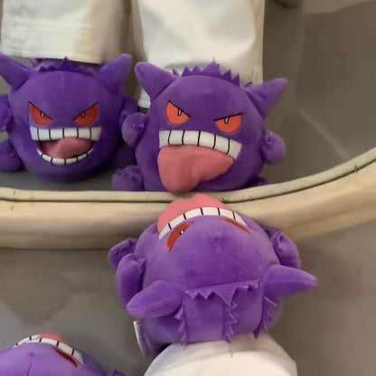Soft plush purple house shoes with a funny monster face