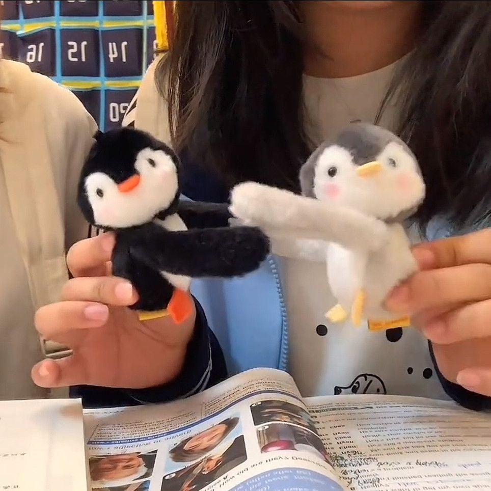 Hugging penguin plush charm