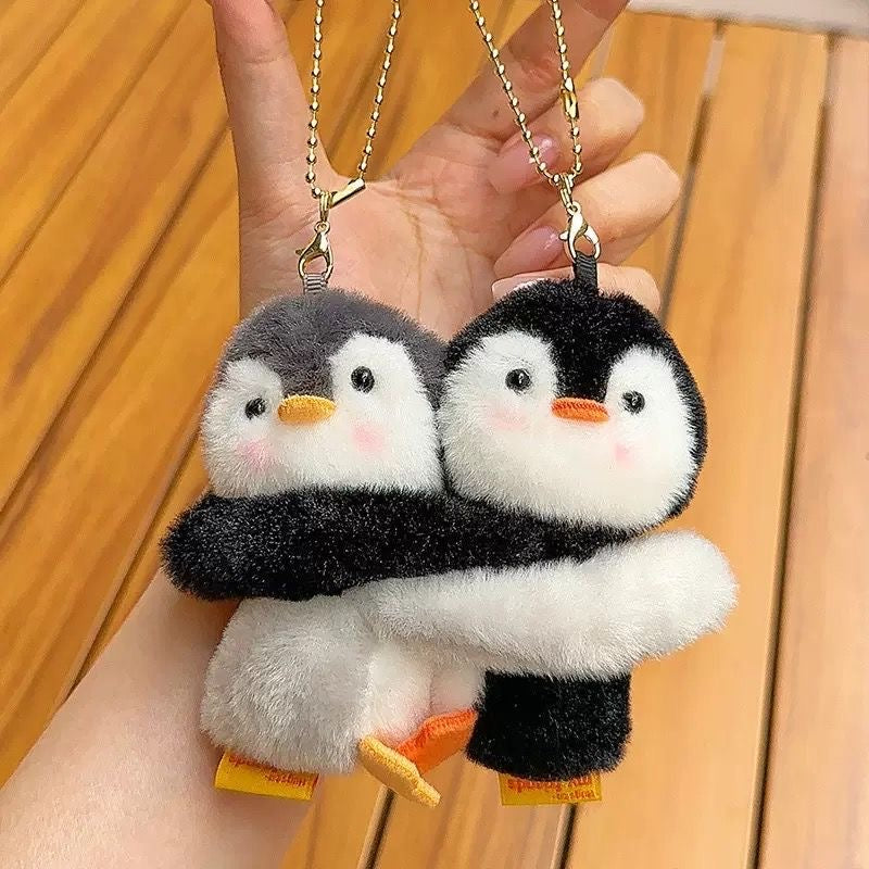 Hugging penguin plush charm