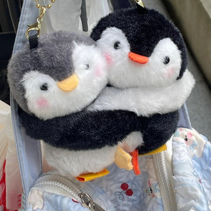 Hugging penguin plush charm