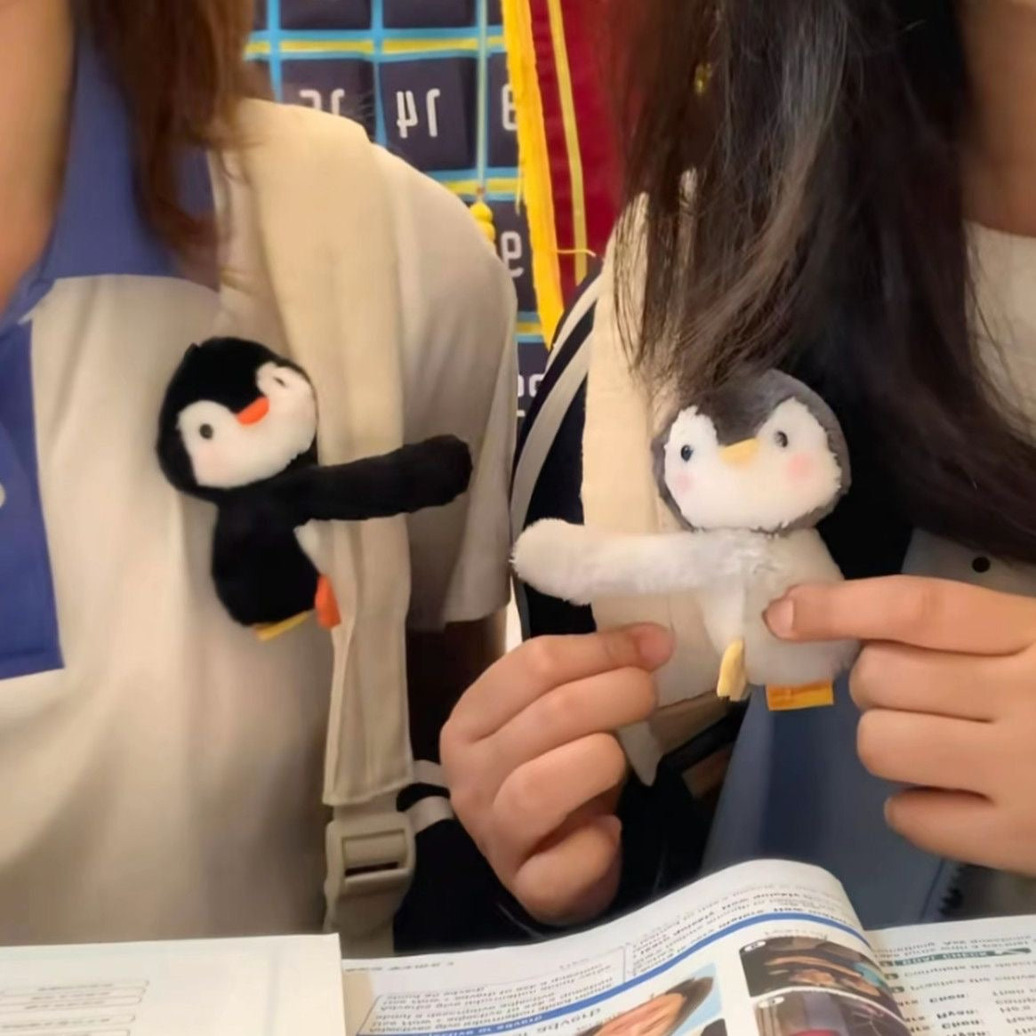 Hugging penguin plush charm