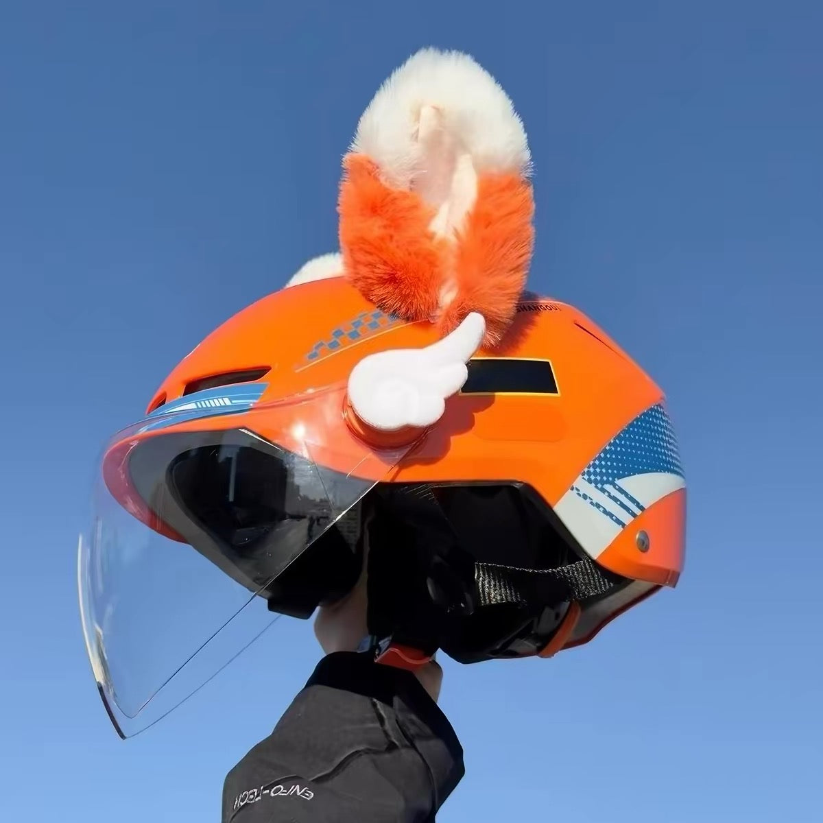 Moving ear for helmet