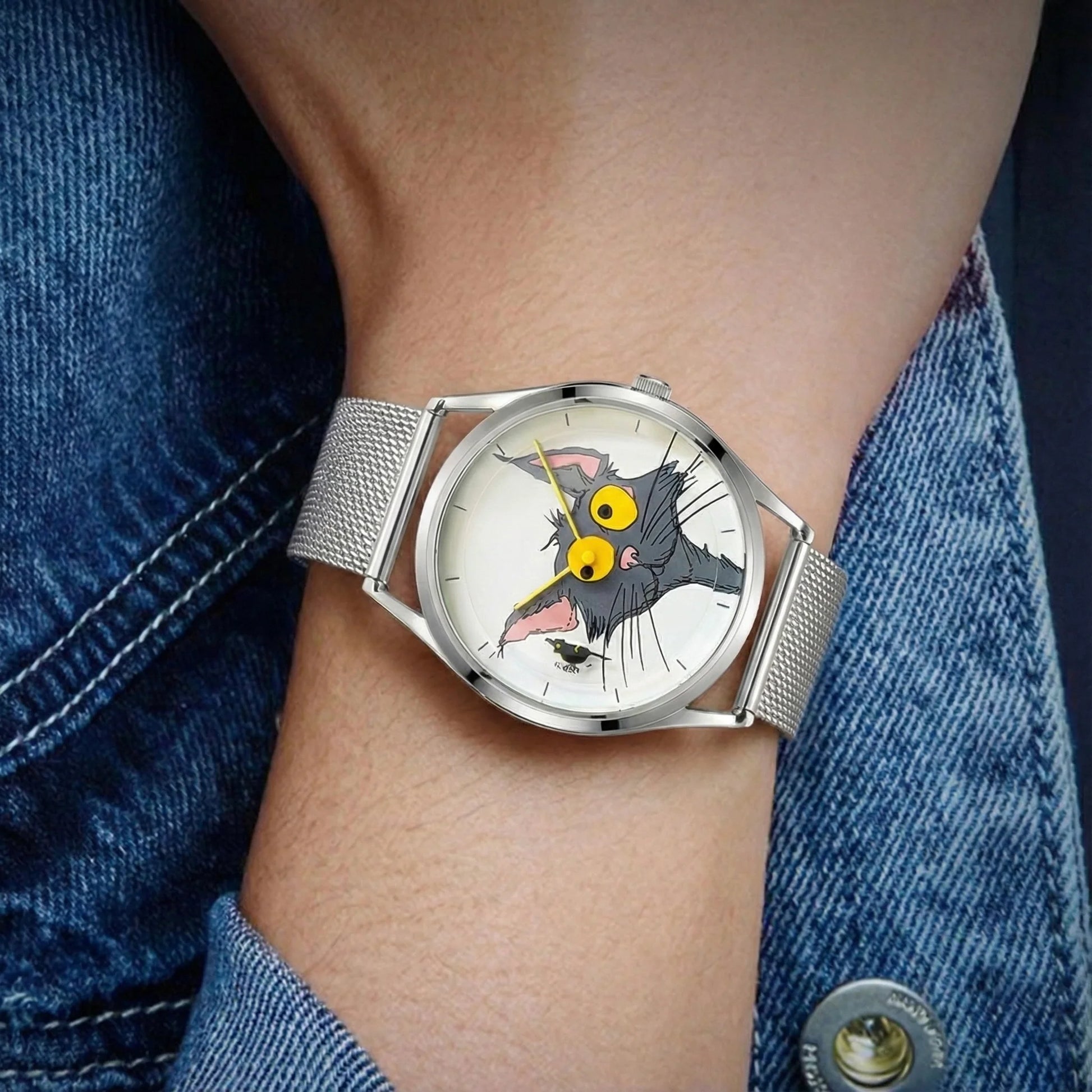 Watch with a cartoon character face on a wrist wearing a denim jacket