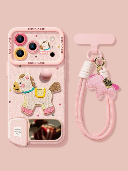 Phone case with horse design and pink strap on a pink background